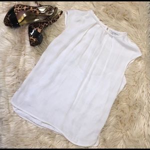 White sleeveless blouse